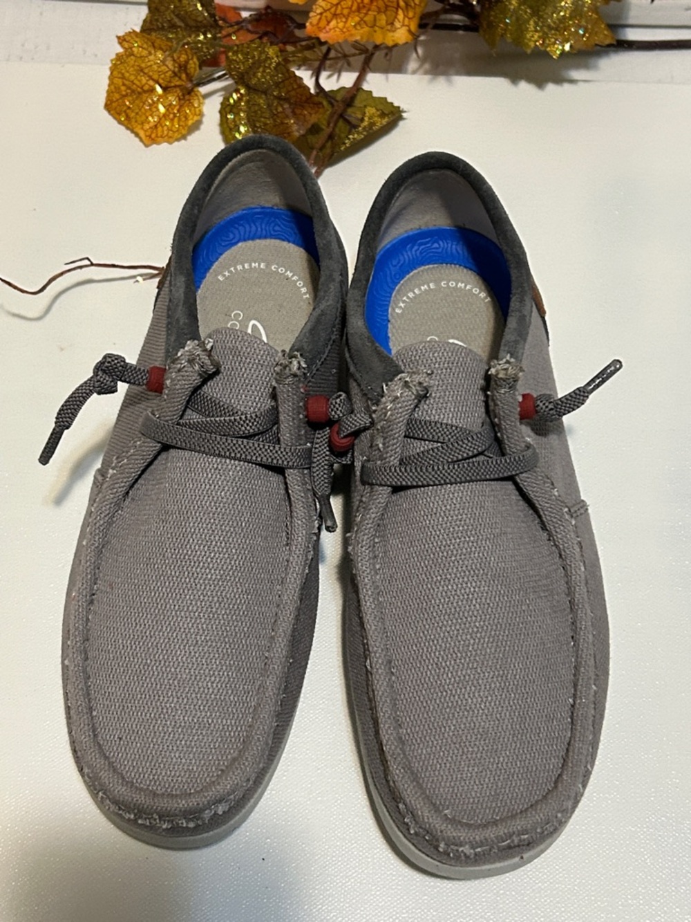 Clarks Gray Canvas Slip-Ons with Blue Insole and Red Lace Accents